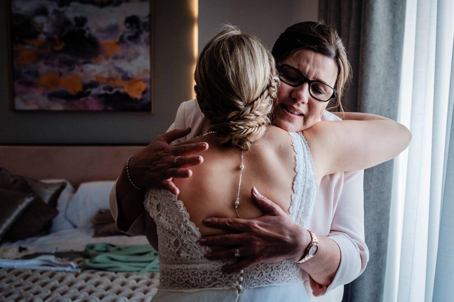 bride and mum hugging devon wedding photographer