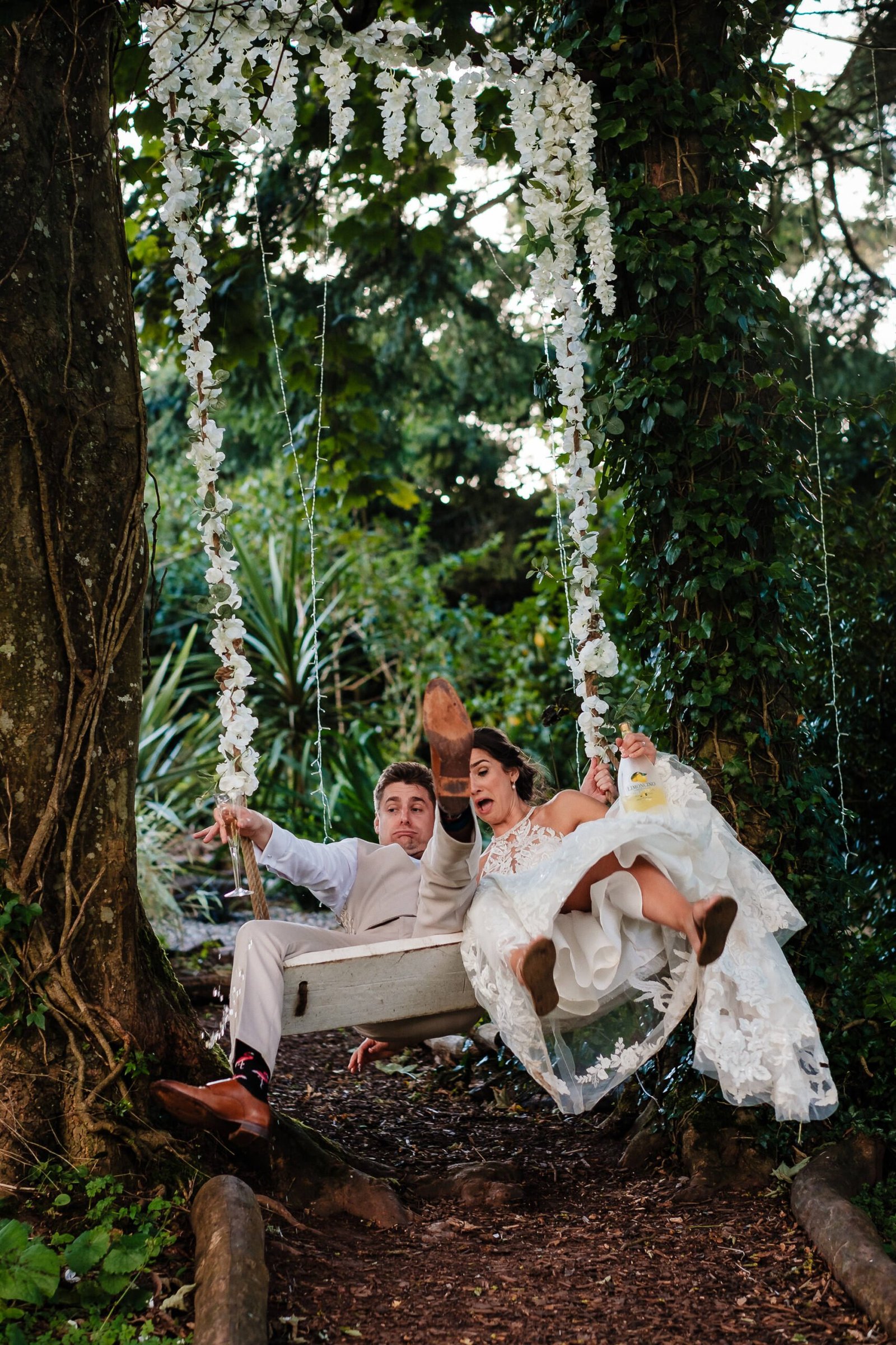 bride and groom on swing at beaconside house